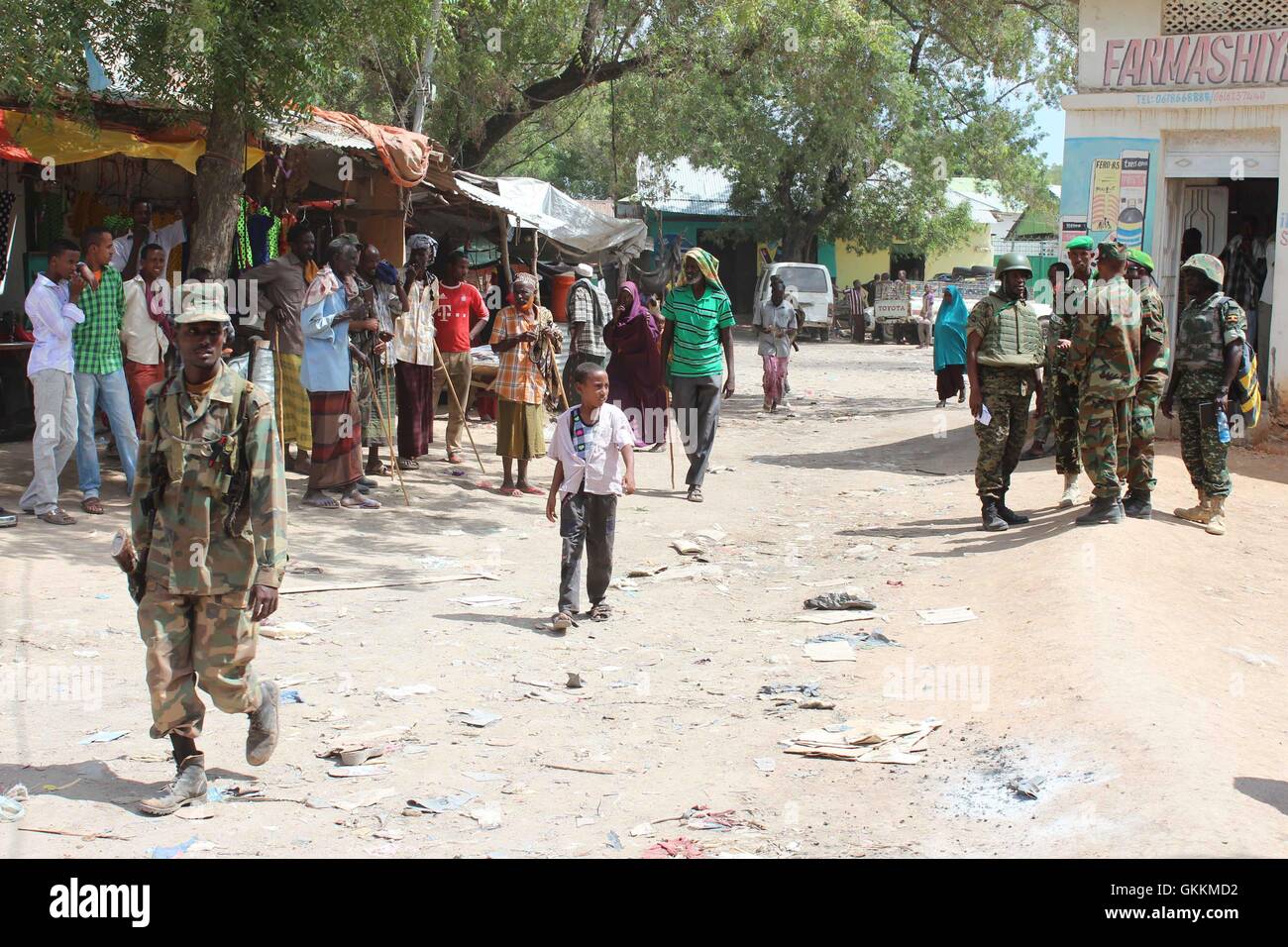 Military officers from the African Union Mission in Somalia (AMISOM) visit Bardera market on August 12, 2015 to witness the restoration of normalcy of business after Al Shabaab was ousted from the town. AMISOM Photo/ Abdi Dakane Stock Photo