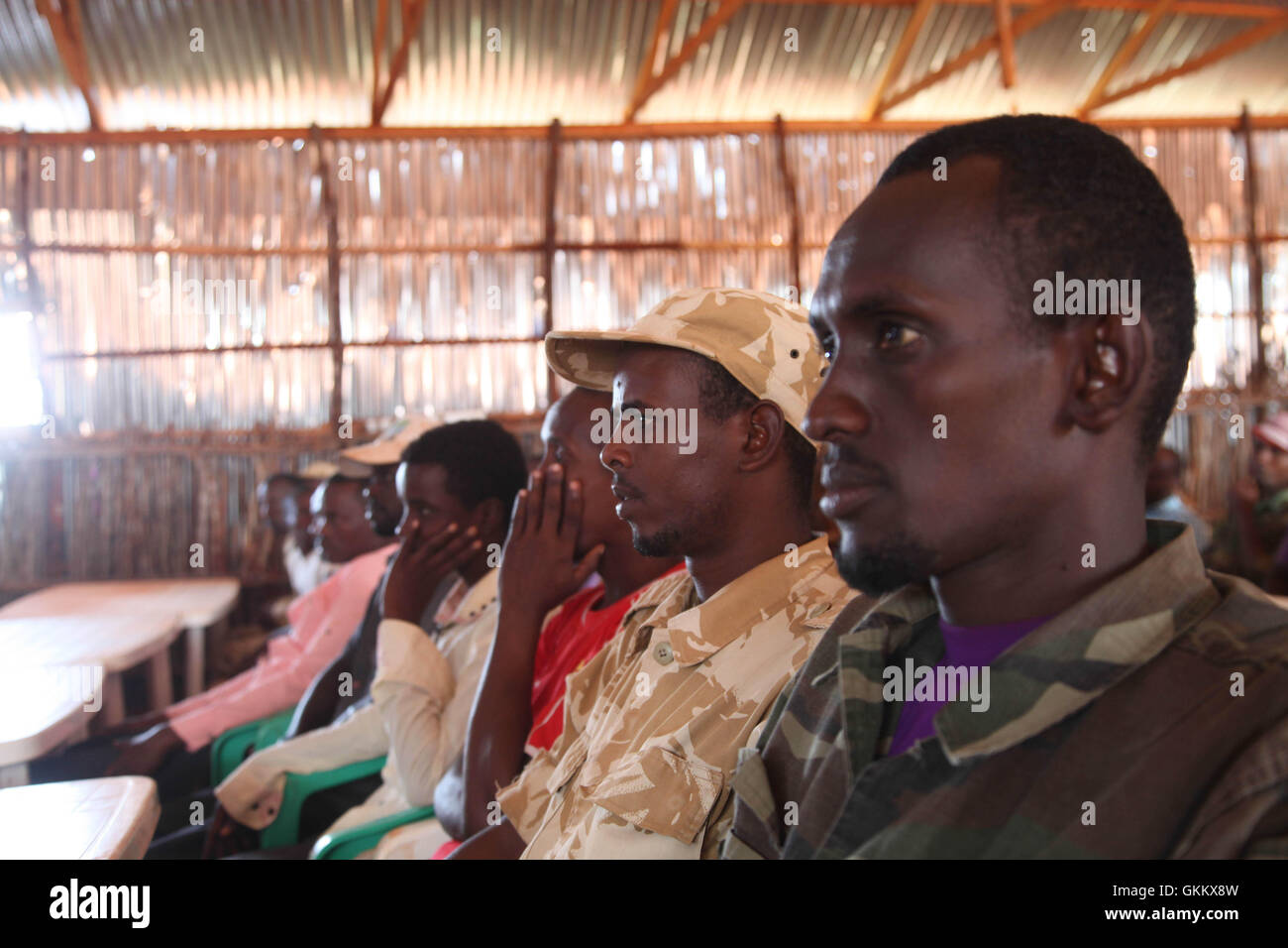 Police recruits for the Interim Jubbaland Administration (IJA) wait for registration before commencing training in Kismayo, Somalia on July 07, 2016. The training is conducted by the African Union Mission in Somalia. AMISOM Photo/ Awil Abukar Stock Photo