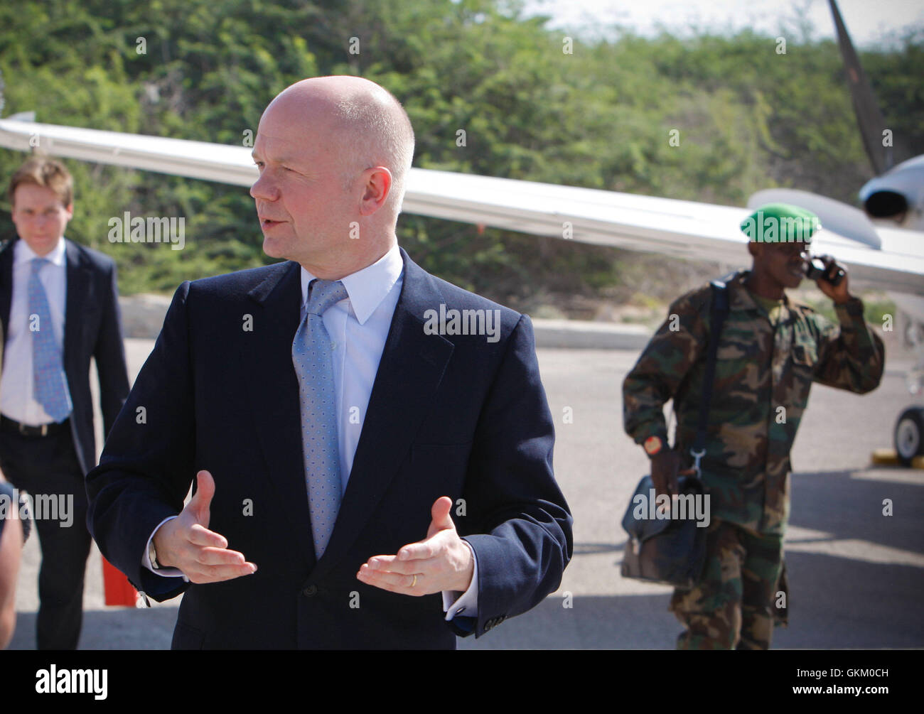 SOMALIA, Mogadishu: In a photograph released by the African Union-United Nations Information Support Team 2 February, British Foreign Secretary William Hague gestures after arriving at Mogadishu International Airport in the Somali capital. Hague was today the first British Foreign Secretary to set foot in Somalia for over 20 years, where he met with the leadership of the African Union Mission in Somalia (AMISOM) and the president of the Somali Transitional Federal Government (TFG) Sheik Sharif Sheik Ahmed, and formally introducing the credentials of the UK's new ambassador to the country, Mark Stock Photo
