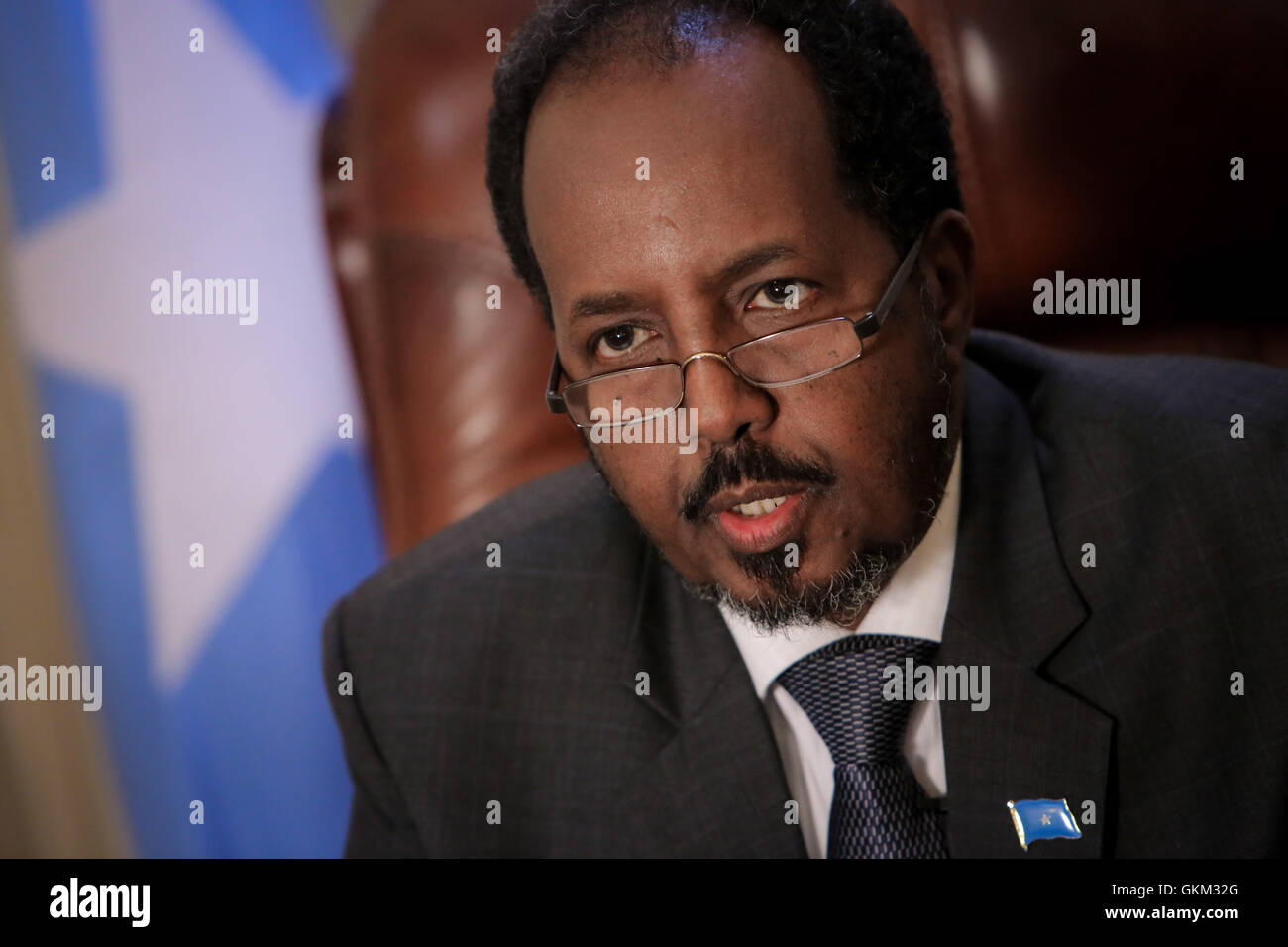 SOMALIA, Mogadishu: In photograph taken and released by the African Union-United Nations Information Support Team 19 April 2013, Somali President Hassan Sheik Mohamud is seen in his presidential office inside Villa Somalia, the complex which houses the Somali government in the country's capital Mogadishu. Listed in this year's Time Magazine list of the 100 most influential people, Mohamud is president of Somalia's first democratically elected government after two decades of civil war unrest and conflict in the Horn of Africa nation. AU-UN IST PHOTO / STUART PRICE. Stock Photo