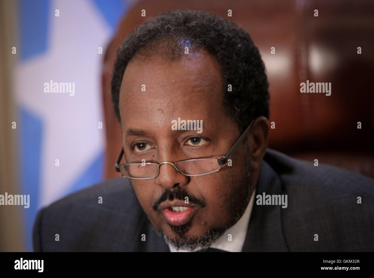 SOMALIA, Mogadishu: In photograph taken and released by the African Union-United Nations Information Support Team 19 April 2013, Somali President Hassan Sheik Mohamud is seen in his presidential office inside Villa Somalia, the complex which houses the Somali government in the country's capital Mogadishu. Listed in this year's Time Magazine list of the 100 most influential people, Mohamud is president of Somalia's first democratically elected government after two decades of civil war unrest and conflict in the Horn of Africa nation. AU-UN IST PHOTO / STUART PRICE. Stock Photo