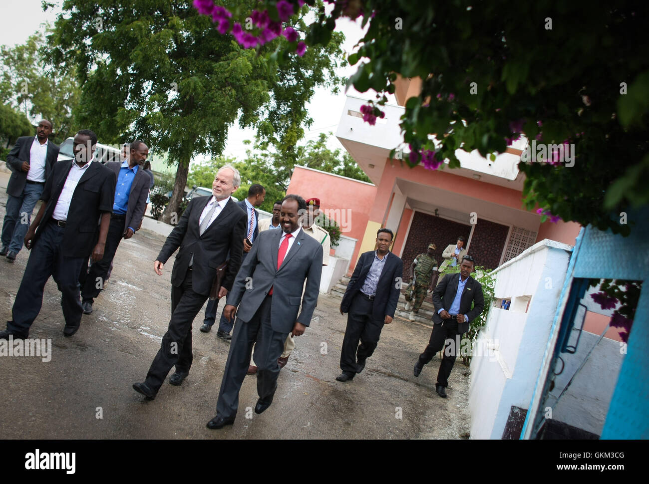 SOMALIA, Mogadishu: In a photograph taken and released by the African Union-United Nations Information Support Team 08 June 2013, Special Representative of the Secretary-General (SRSG) for Somalia, Nicholas Kay, walks with Somali President Hassan Sheikh Mohamud at his presidential offices at Villa Somalia, the complex in central Mogadishu that houses the Federal Government of Somalia. The head of the new United Nations Assistance Mission in Somalia (UNSOM) Kay, today called for an immediate end to fighting in Somalia's southern port city of Kismayo, urging all parties to commit to resolve diff Stock Photo