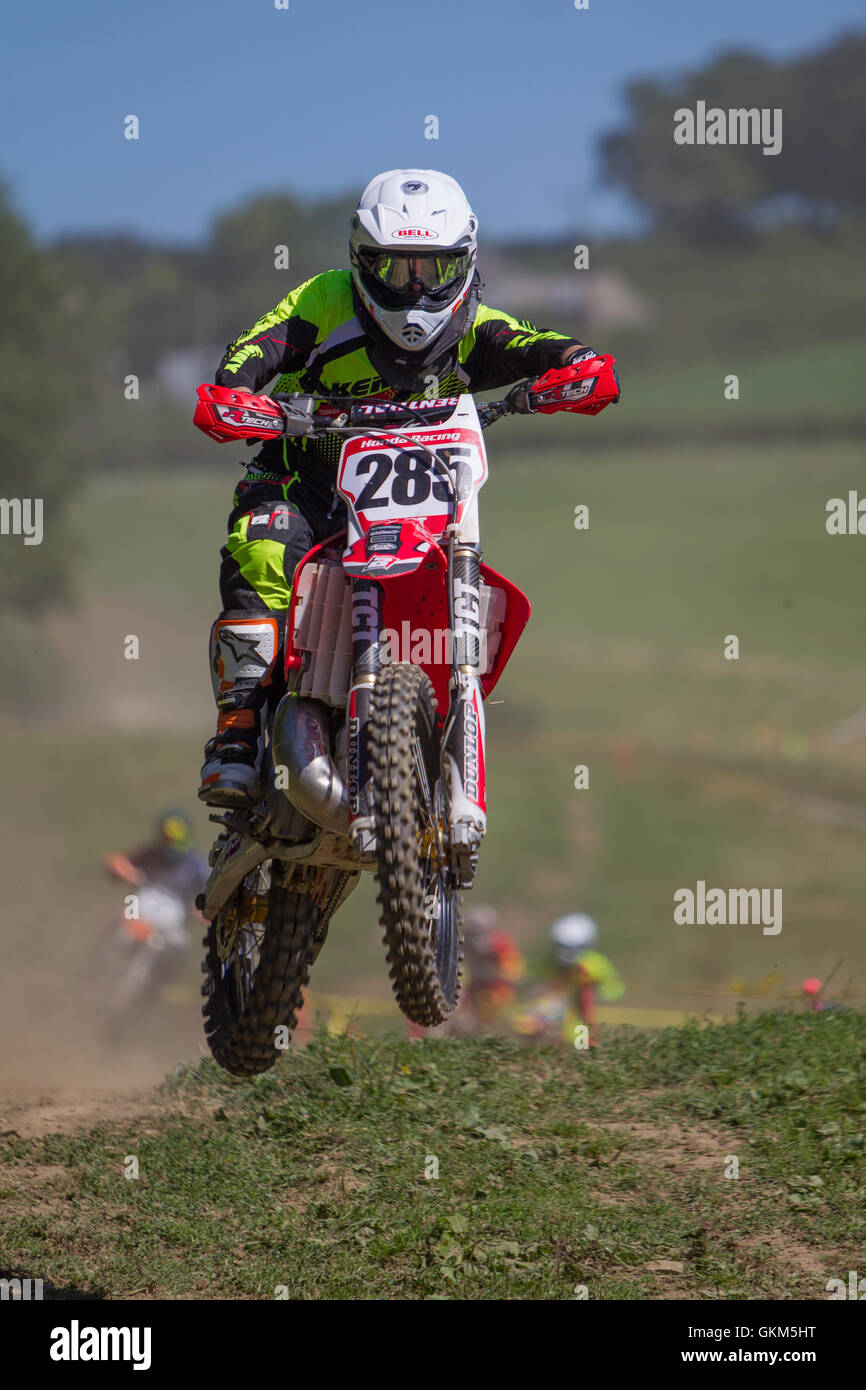 Dirt bike rider in air over jump Stock Photo