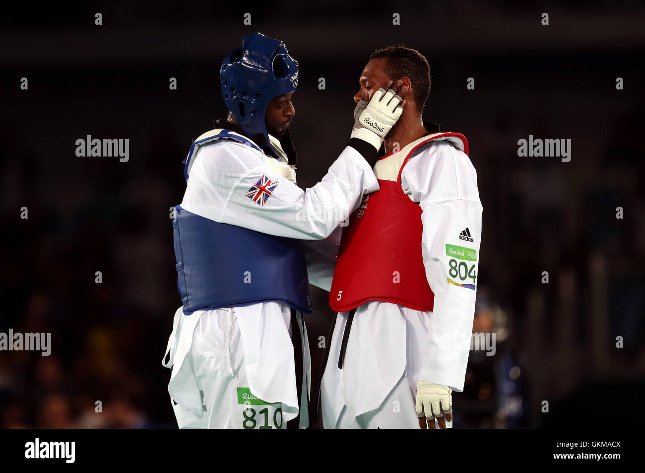 Brazil's Maicon Siqueira (right) and Great Britain's Mahama Cho after the Men's +80kg Taekwondo Bronze medal match at Carioca Arena 3 on the fifteenth day of the Rio Olympic Games, Brazil. Stock Photo