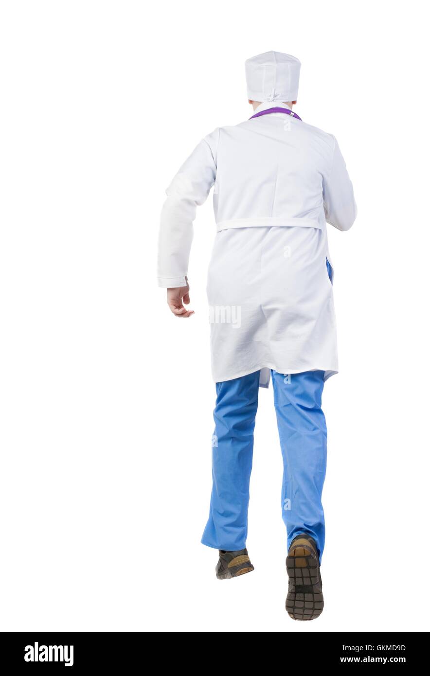 Back view of running doctor in a robe hurrying to help the patie Stock Photo