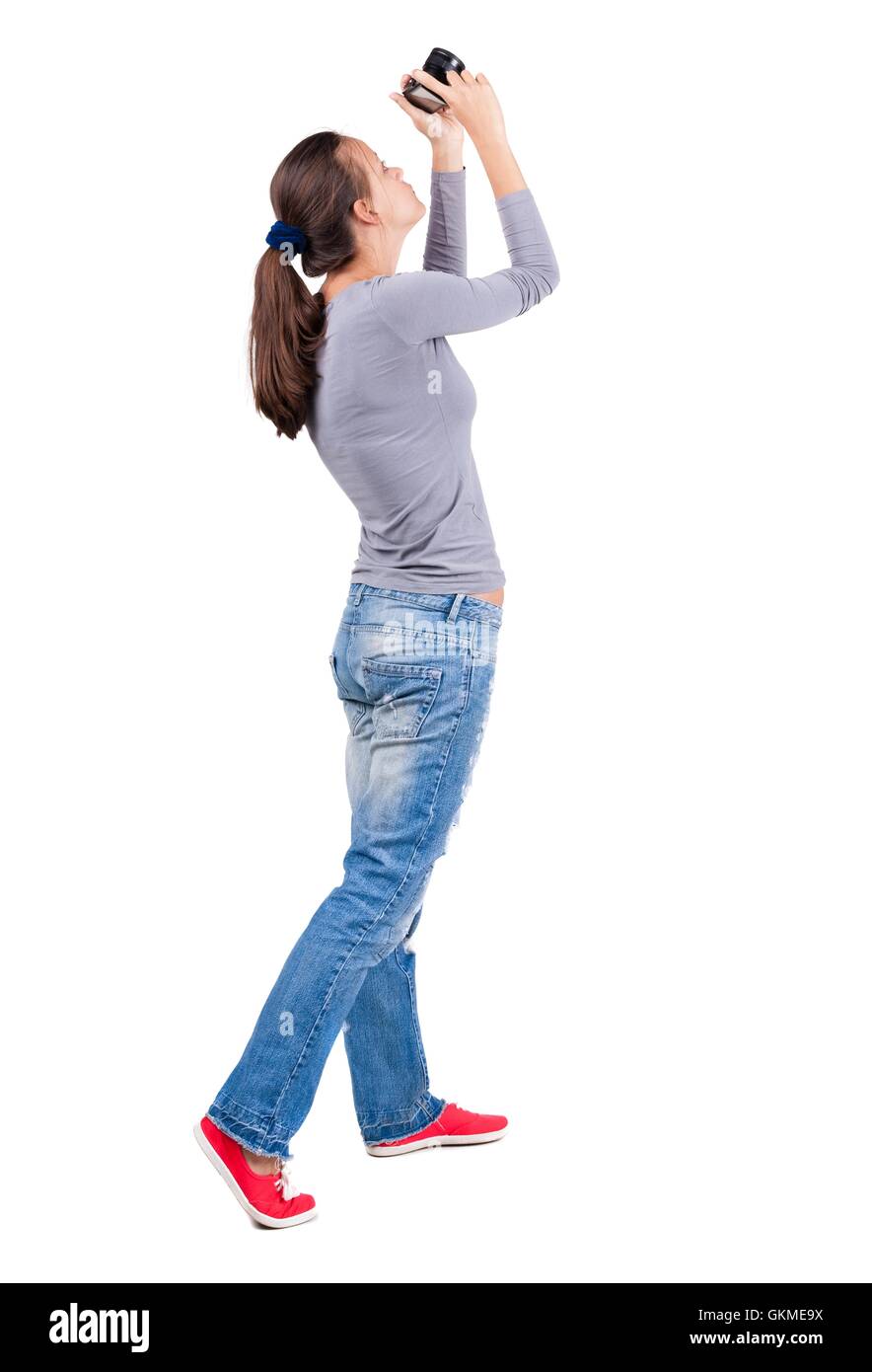 Back view of woman photographing Stock Photo - Alamy