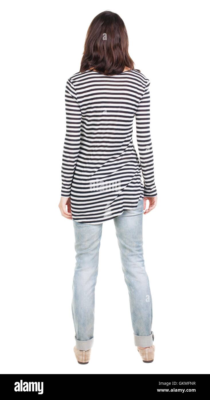back view of standing young beautiful brunette woman in striped Stock ...