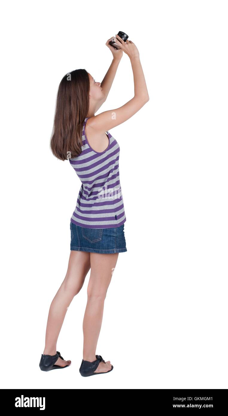 Back view of woman photographing Stock Photo - Alamy