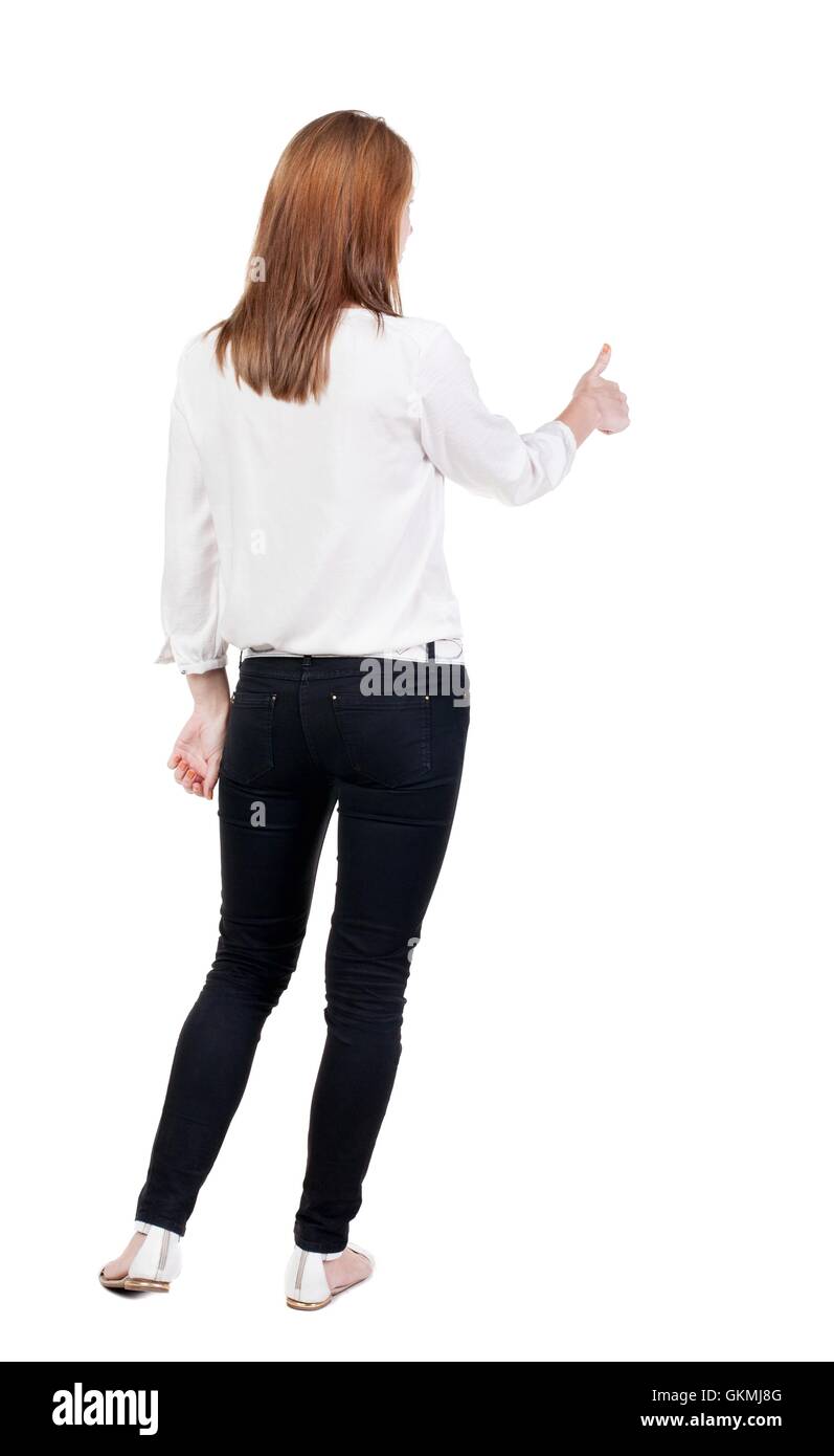 back view of standing young blonde business woman showing thumb up