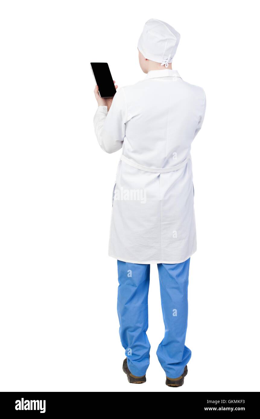 Back view of doctor in robe holding tablet computer. Stock Photo
