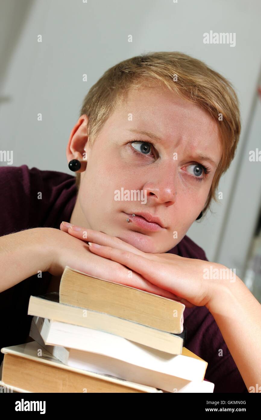 Angry Learn girl with book angry about learning Stock Photo - Alamy