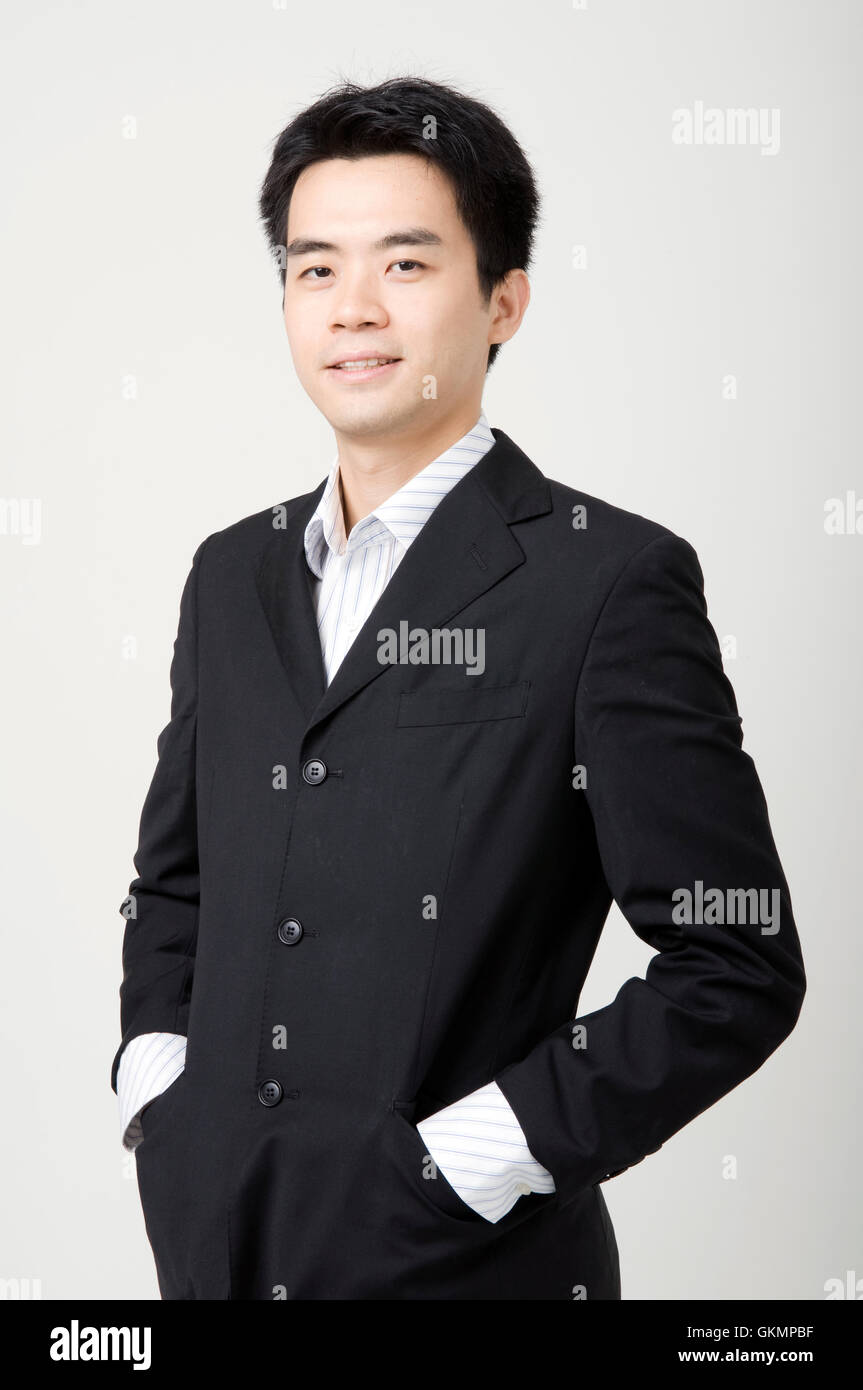 Young asian businessman smiles hi-res stock photography and images - Alamy