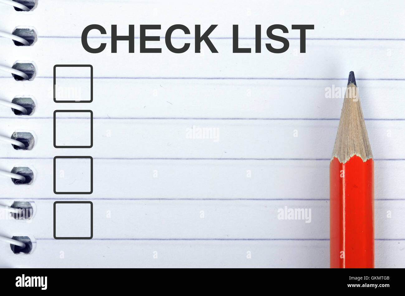 Check list on notepad and red pencil Stock Photo - Alamy