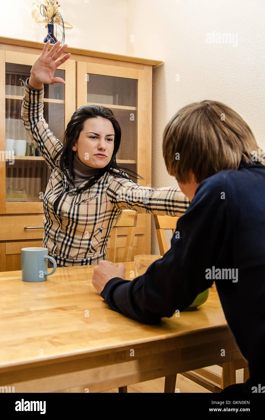 Wife quarrels with her husband in the kitchen Stock Photo