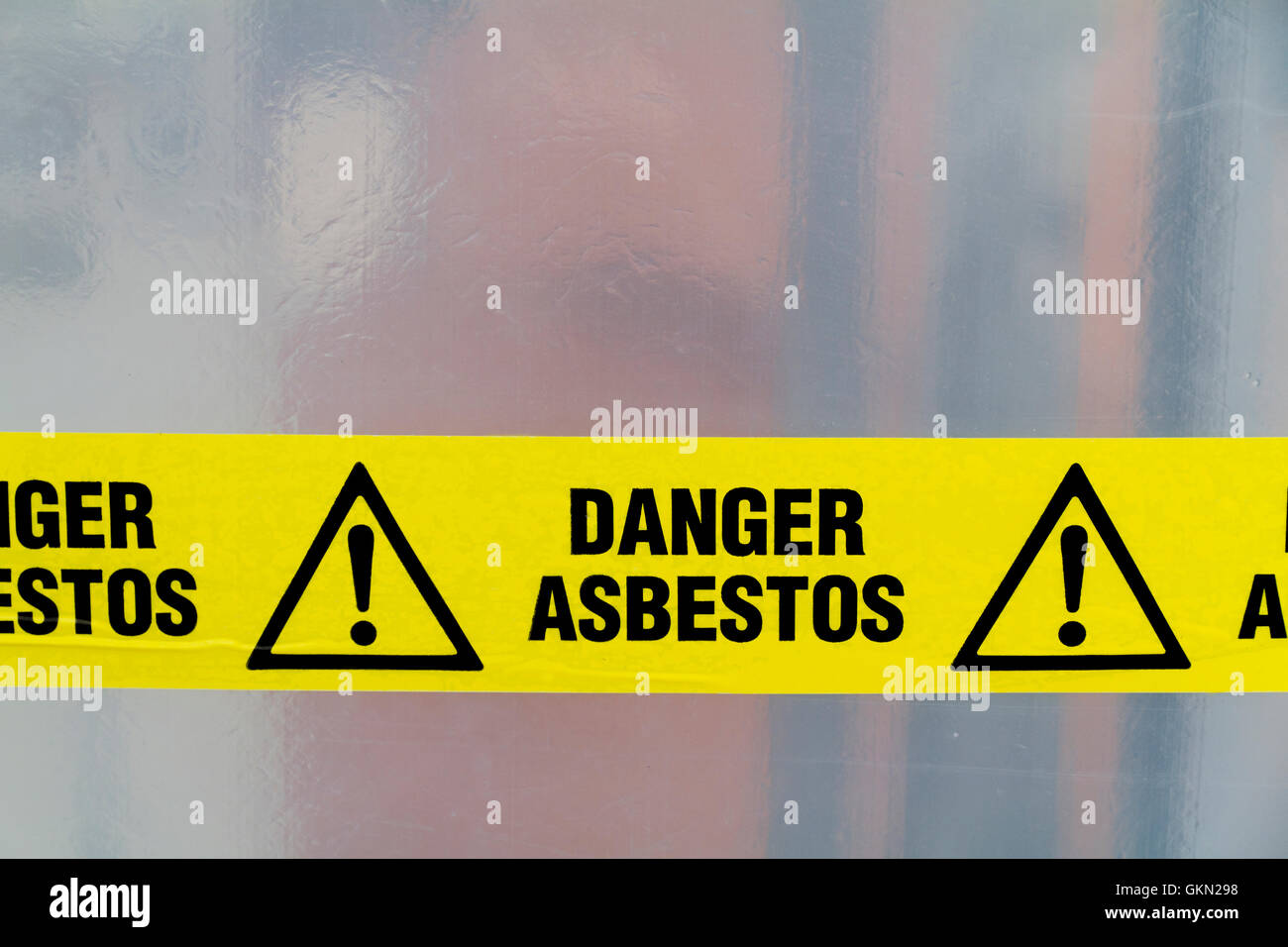 Danger Asbestos yellow warning tape close up Stock Photo Alamy