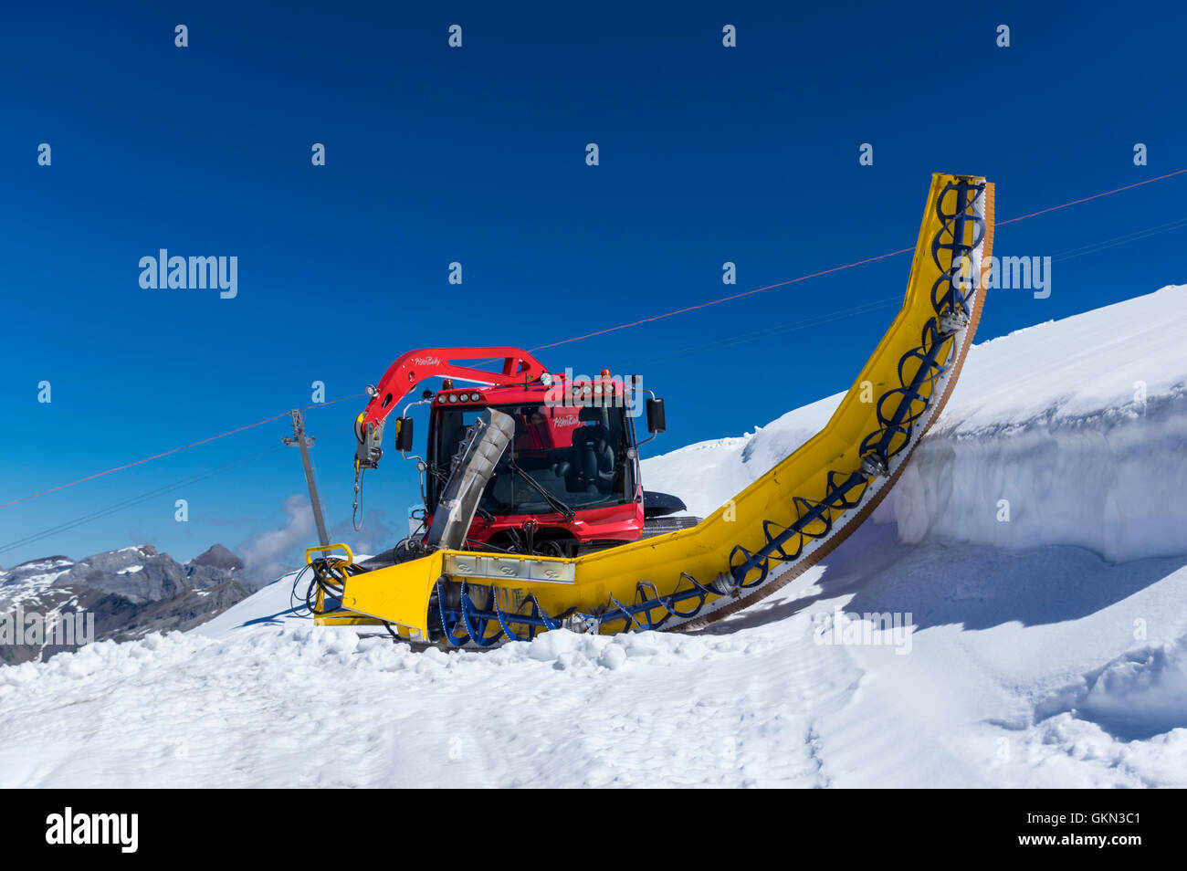 Kässbohrer PistenBully snowcat with halfpipe groomer attached Stock