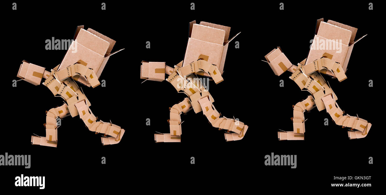 Three box men lifting heavy boxes on black background Stock Photo Alamy