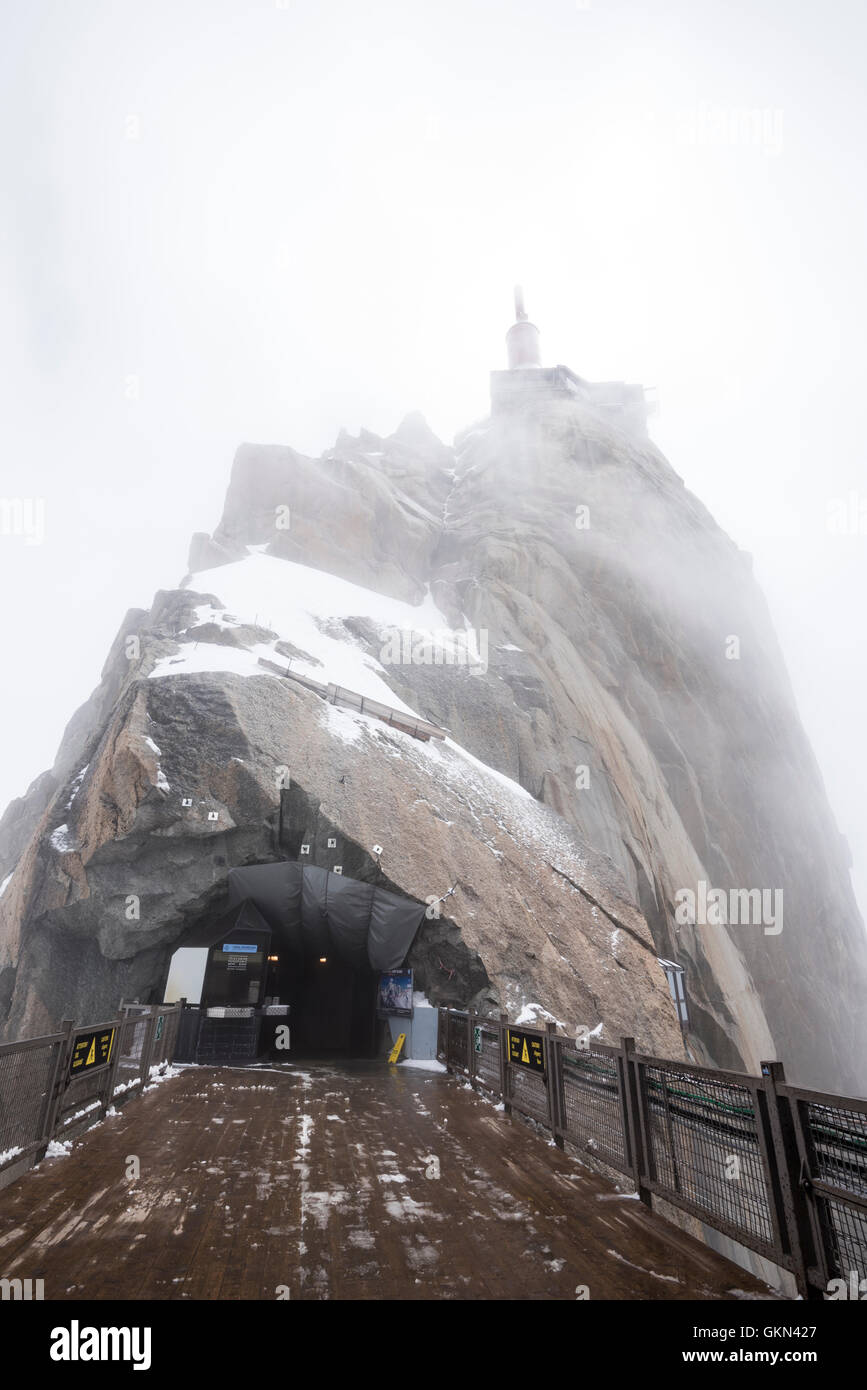 Lower terrace and summit tower at the top of the Aiguille Du Midi Stock Photo
