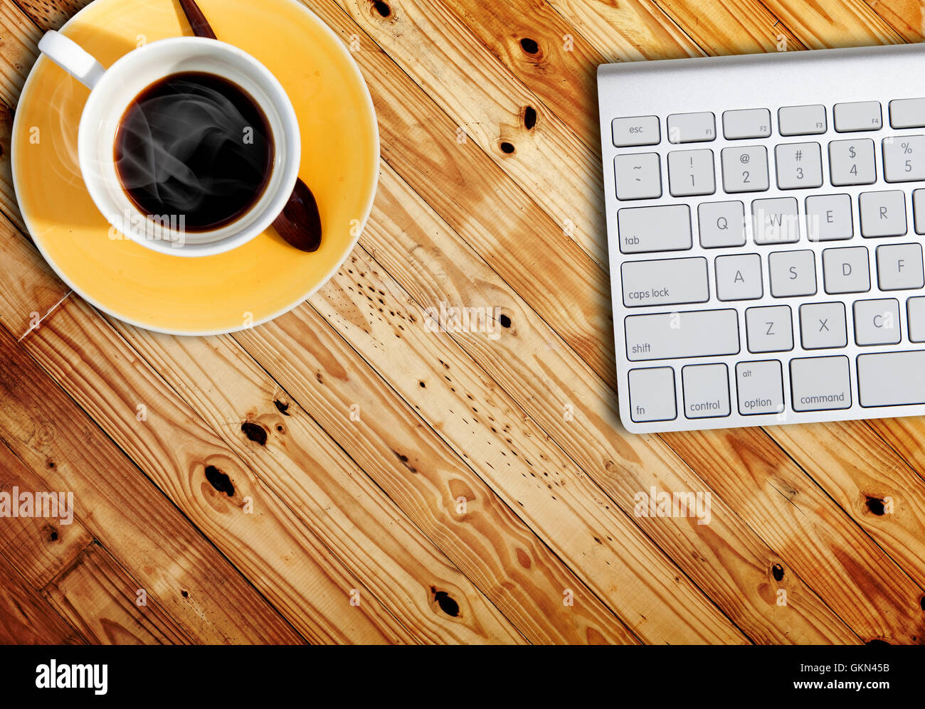 computer keyboard and a cub of coffee on wood table Stock Photo - Alamy