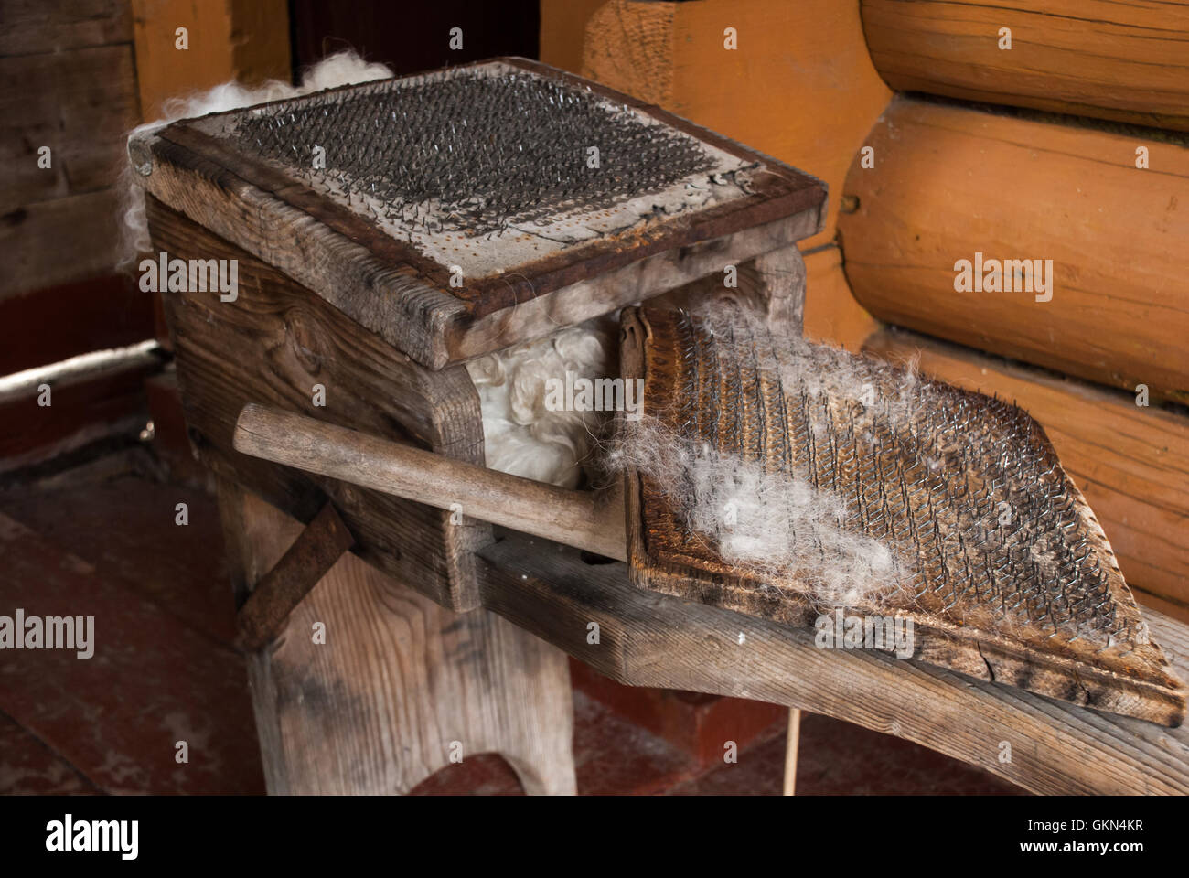 Ancient device for carding fleece in the old hut Stock Photo - Alamy