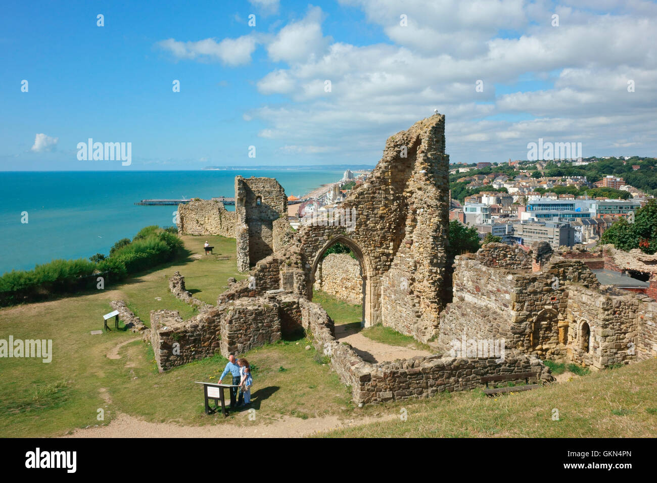 Hastings UK. Visitors reading the history of Hastings Castle ruins, East Sussex, England, UK,  Britain, GB Stock Photo