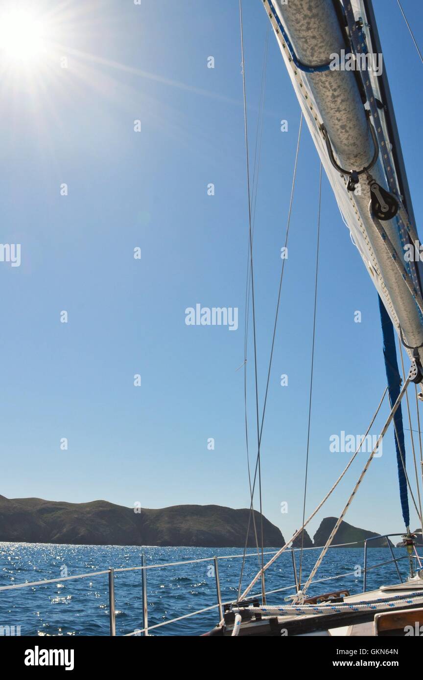 Sunlight against the sail Anacapa Island Stock Photo