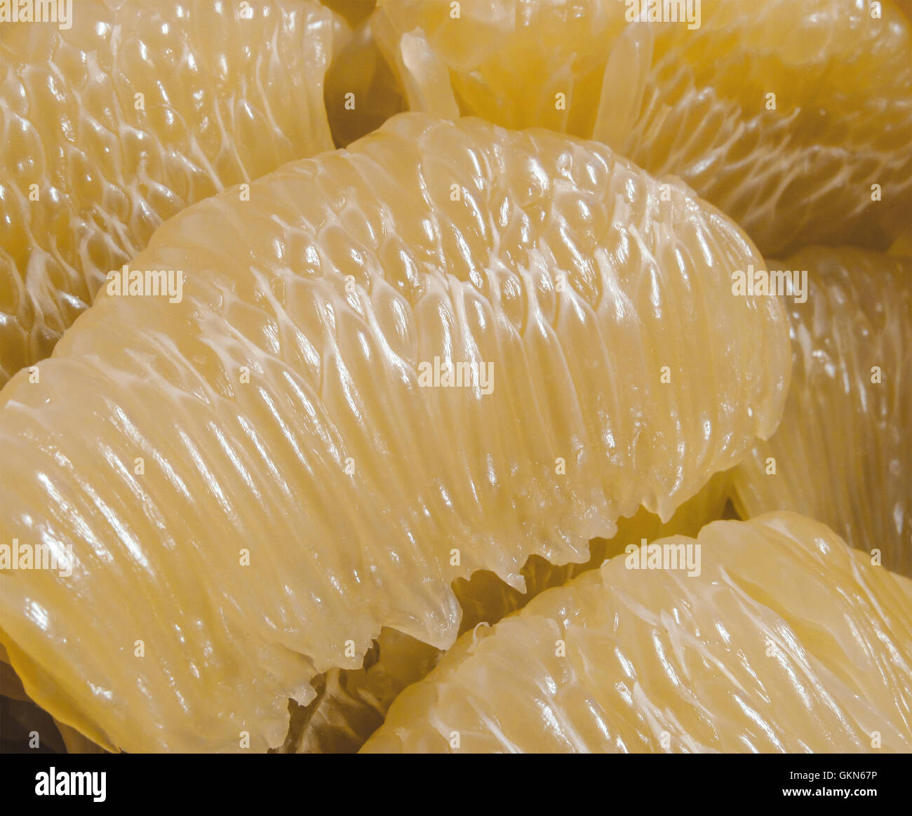 Many pieces of yellow peeled pomelo, sweet tropical fruit Stock Photo