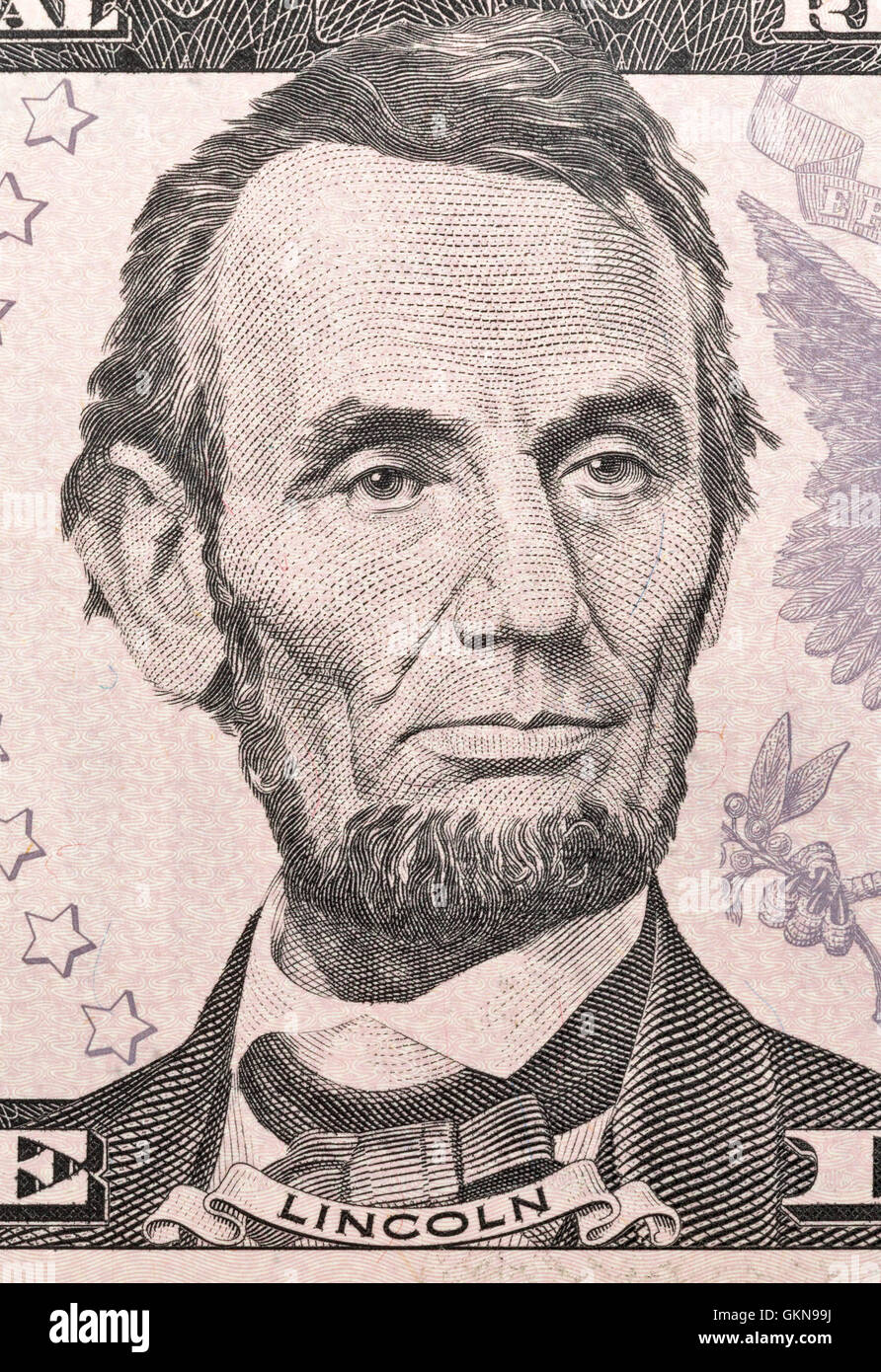 US President Abraham Lincoln portrait on five dollar bill macro Stock Photo