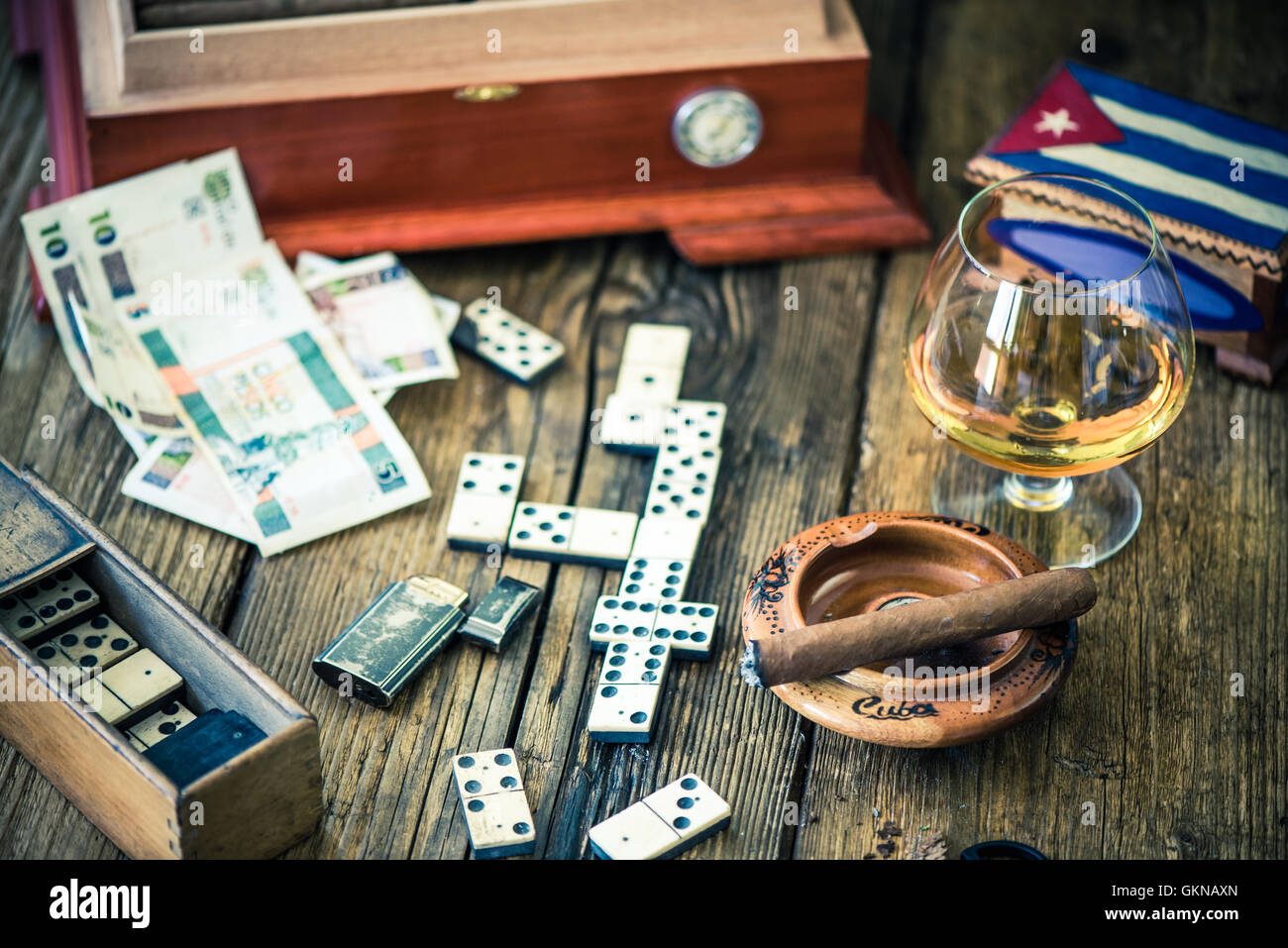 playing cuban domino for money and smoking cigars with rum Stock Photo -  Alamy
