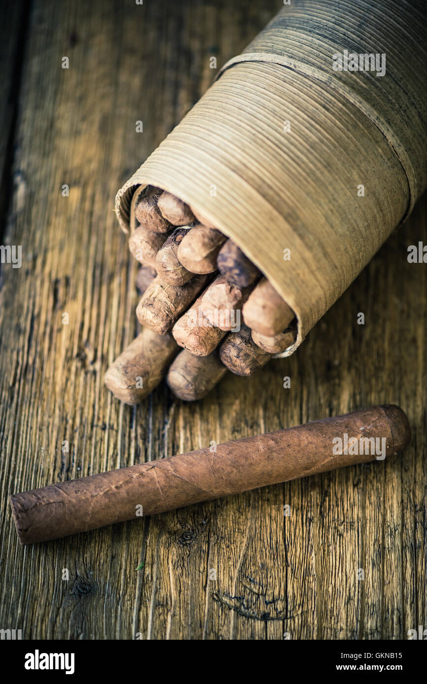 handmade cigar on wooden table, moody dark image Stock Photo - Alamy