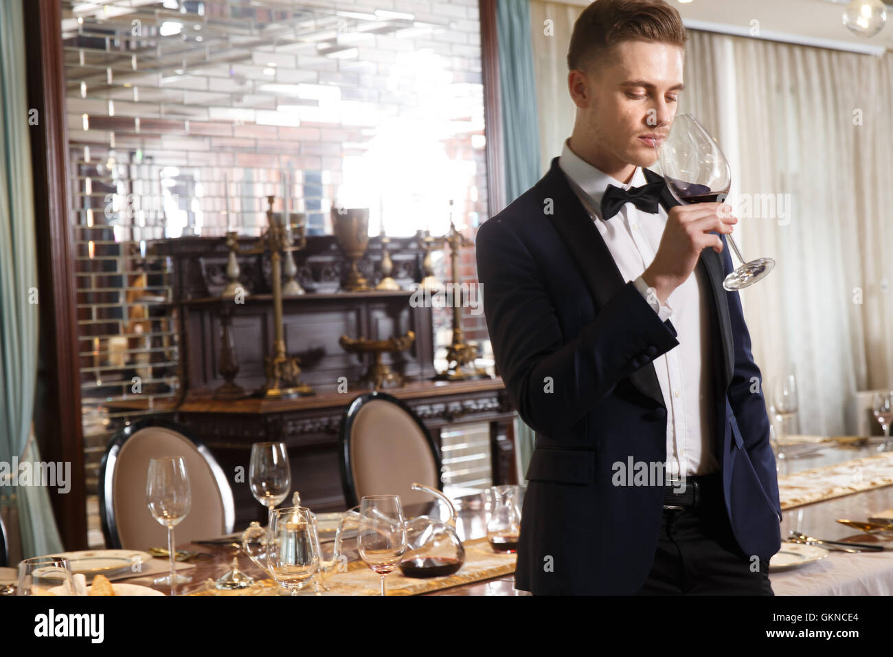 Young men drinking red wine Stock Photo - Alamy
