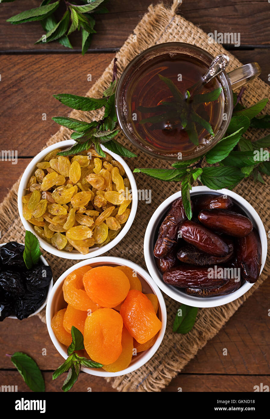 Mix dried fruits (date palm fruits, prunes, dried apricots, raisins) and nuts, and traditional