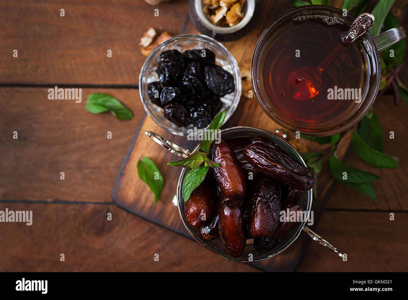 Mix dried fruits (date palm fruits, prunes, dried apricots, raisins) and nuts, and traditional
