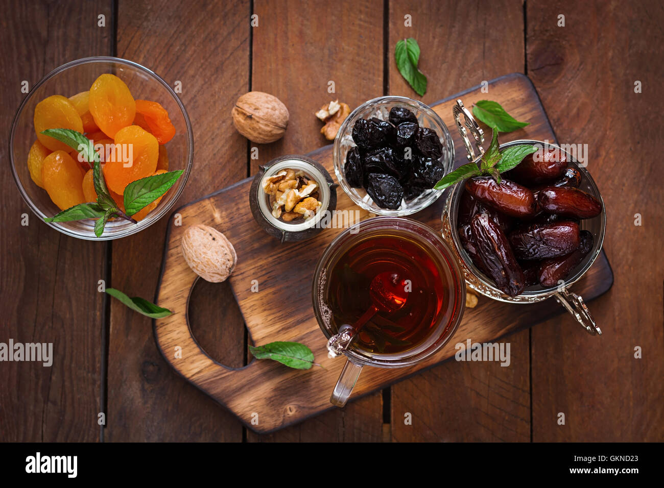 Mix dried fruits (date palm fruits, prunes, dried apricots, raisins) and nuts, and traditional
