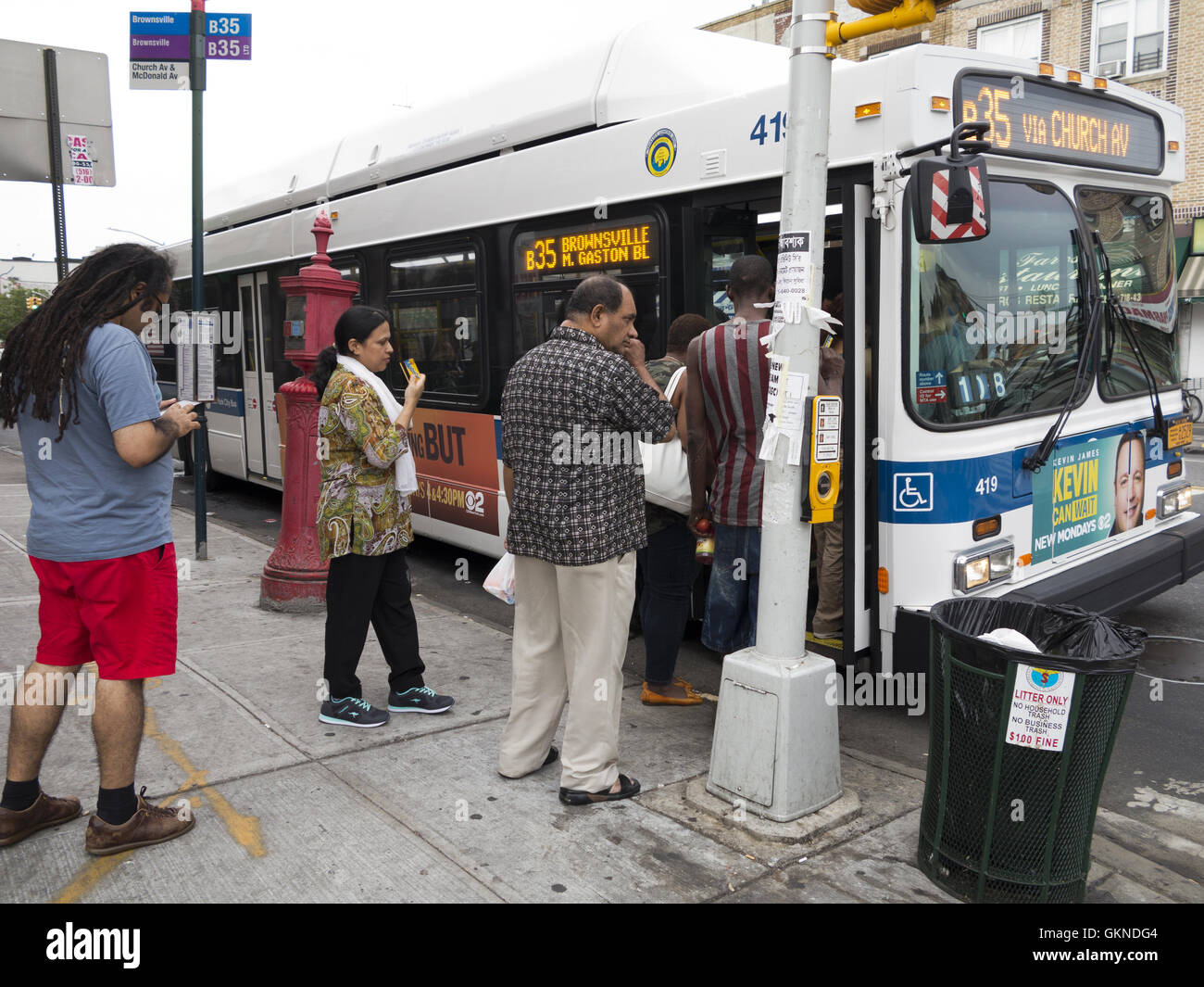 Pedestrians board the B-35 bus in the Kensington section of Brooklyn ...