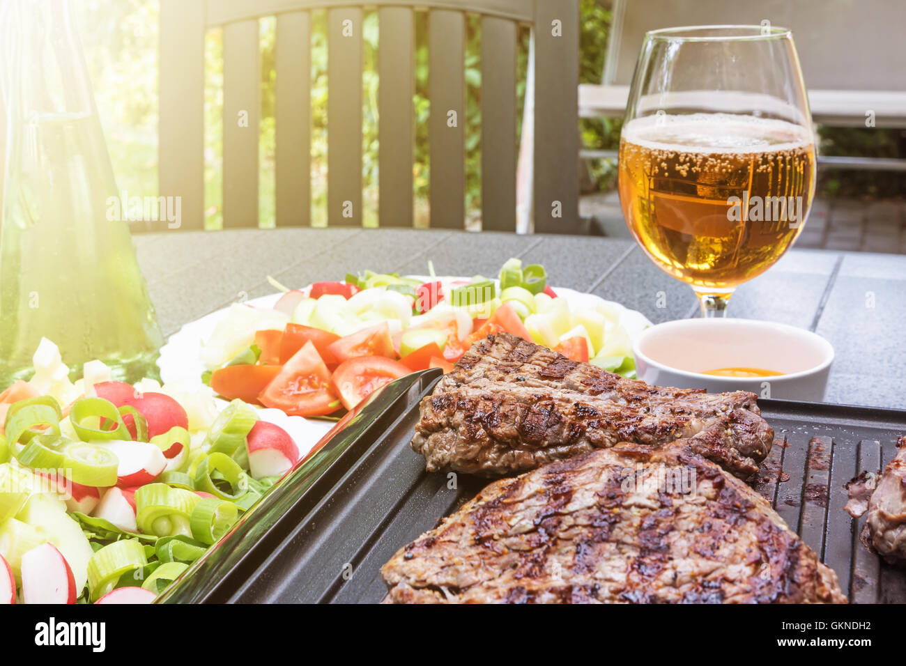 Grill steaks browned on both sides are on an electric stove Stock Photo