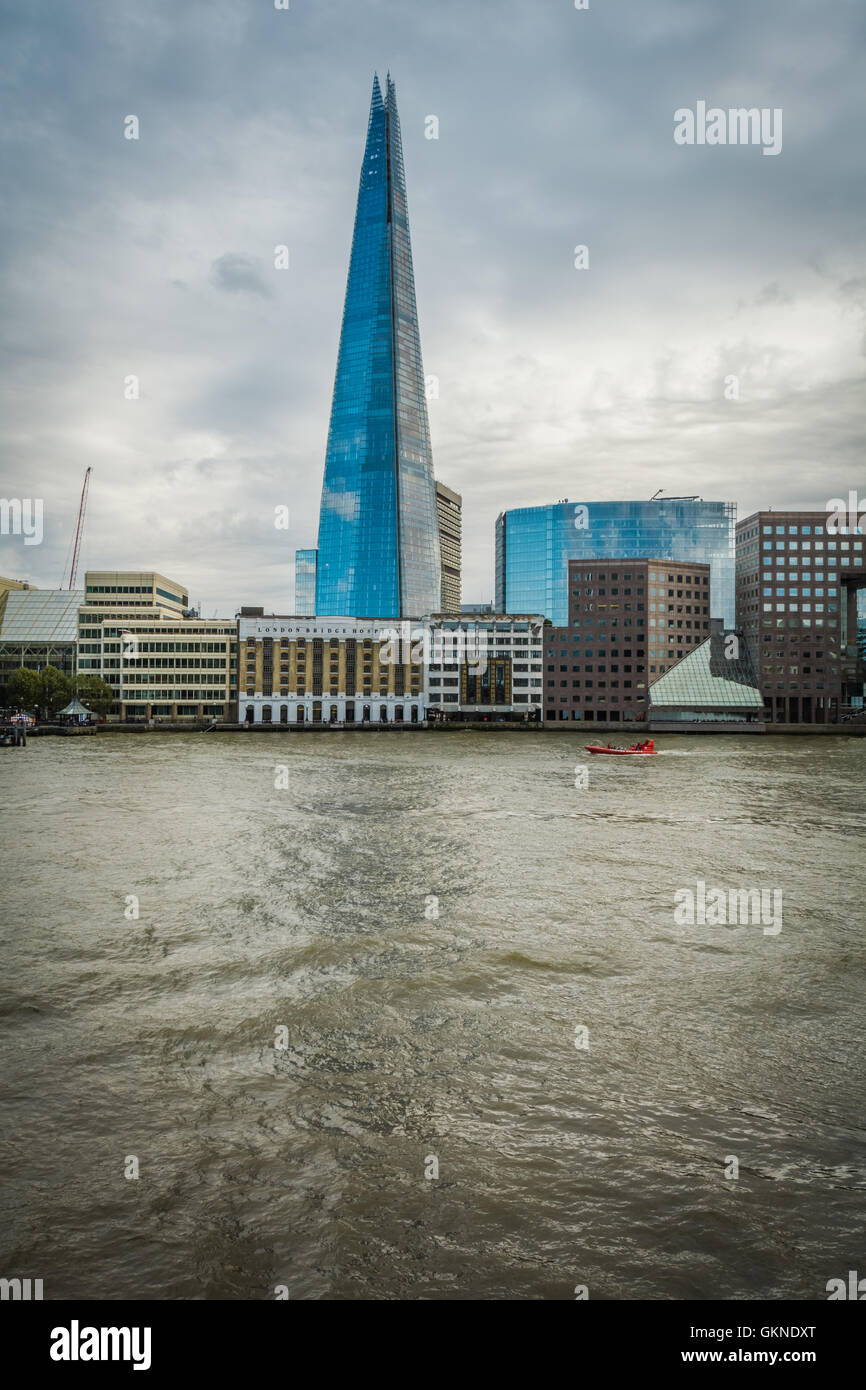 The Shard on a cloudy day next to the river Thames in London, UK Stock Photo