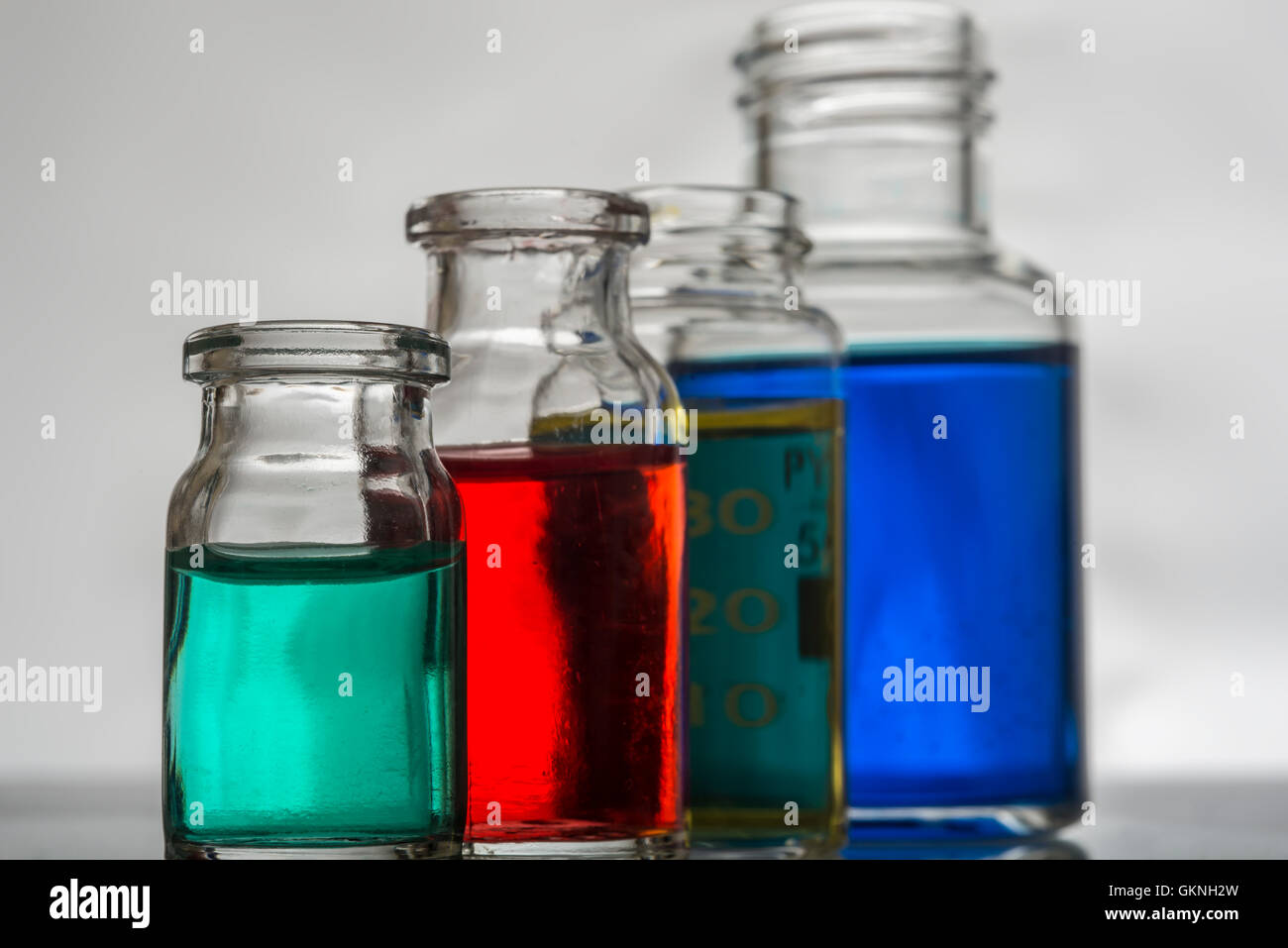Set of laboratory bottles with color liquid Stock Photo