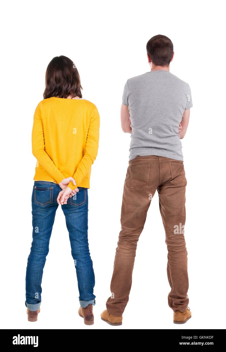Back view of young couple hug and look into the distance Stock Photo ...
