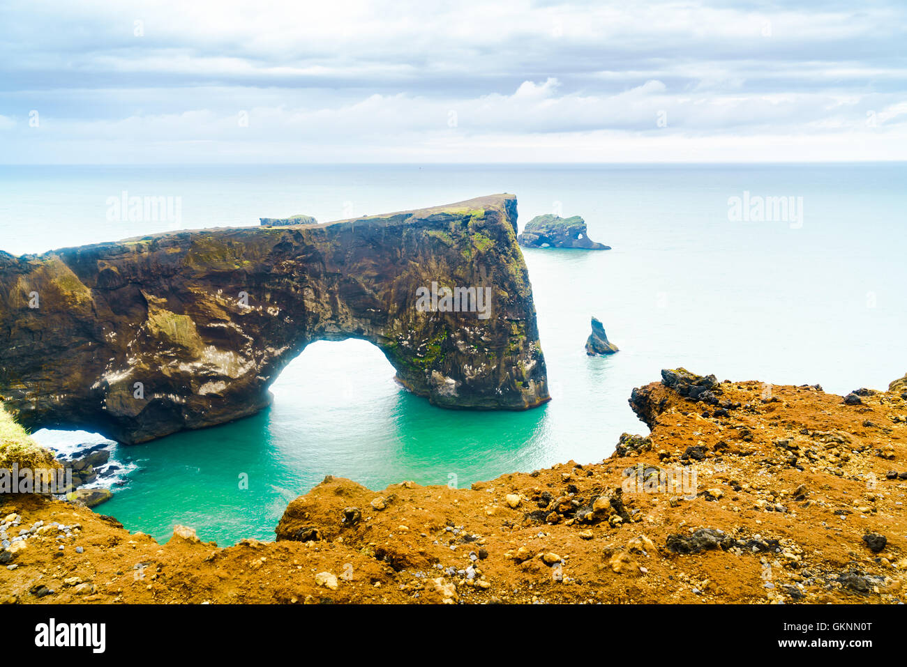 Natural Arch, the rock formation at the cape Dyrholaey near the village of Vik In Iceland Stock Photo