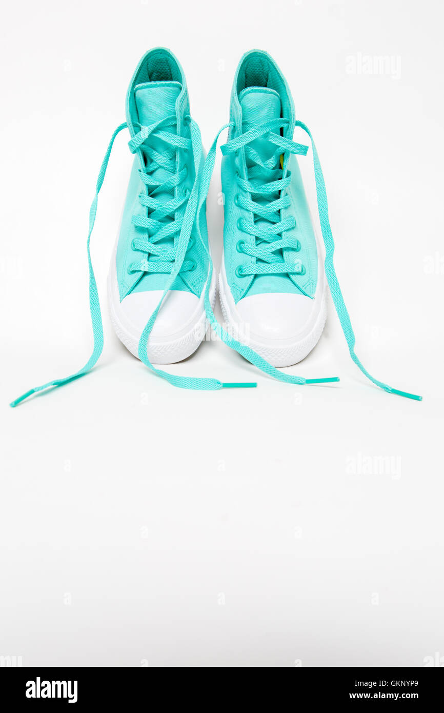 Pair of shoes with long laces untied Stock Photo