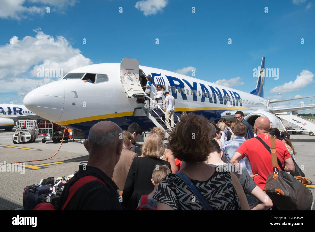Passengers boarding Ryanair plane at Stansted Airport for flight to Carcassonne,South of France. Stock Photo