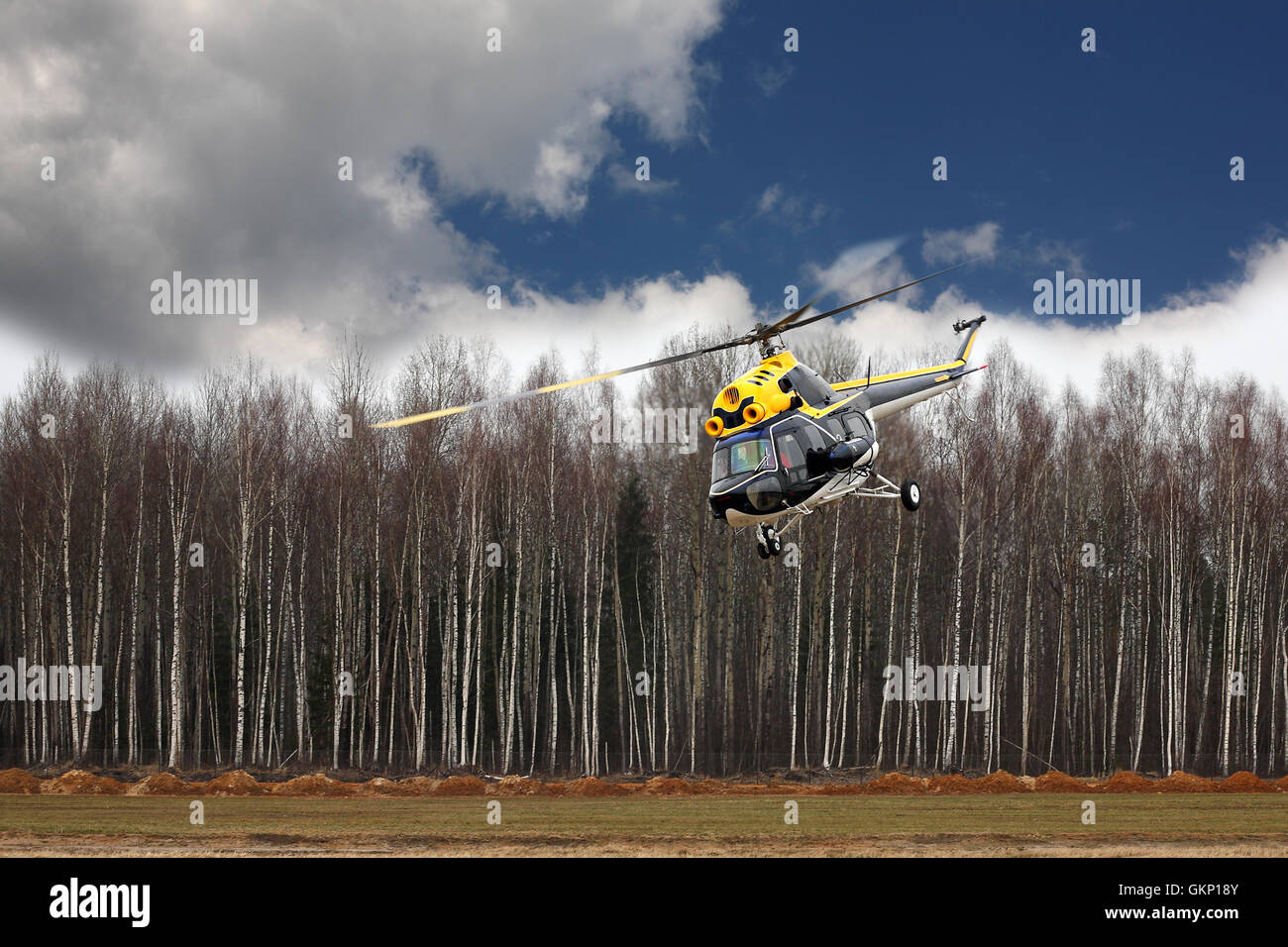 Aircraft Big blackyellow helicopter at competitions makes flight at
