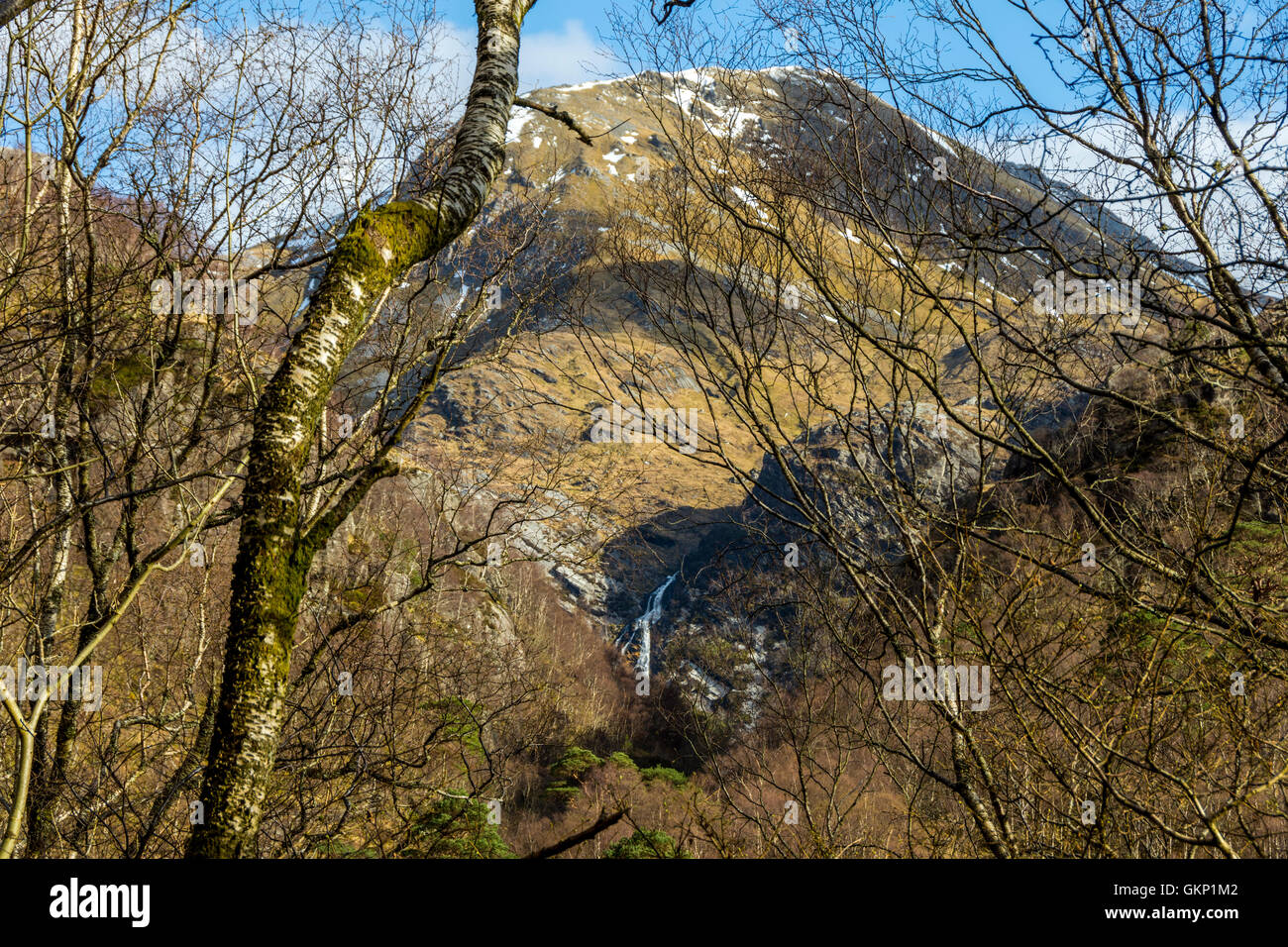 Steall Falls and the peak of An Gearanach from the footpath through the Nevis Gorge, Glen Nevis, near Fort William, Scotland, UK Stock Photo