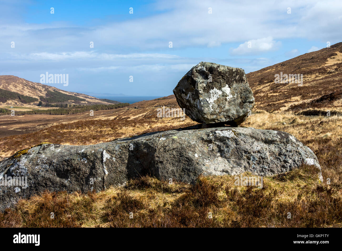Clach Cuid Fìr, the manhood stone, a perched rock in Kinloch Glen, Isle of Rum, Inner Hebrides, Scotland, UK Stock Photo
