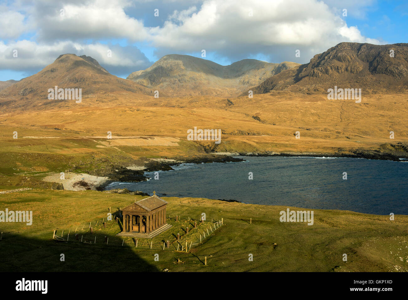 The Bullough Mausoleum and the Rum Cuillin hills from Harris Bay, Isle of Rum, Scotland, UK. Stock Photo