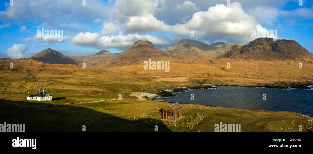 Harris Lodge, the Bullough Mausoleum and the Rum Cuillin hills from Harris Bay, Isle of Rum, Scotland, UK. Stock Photo