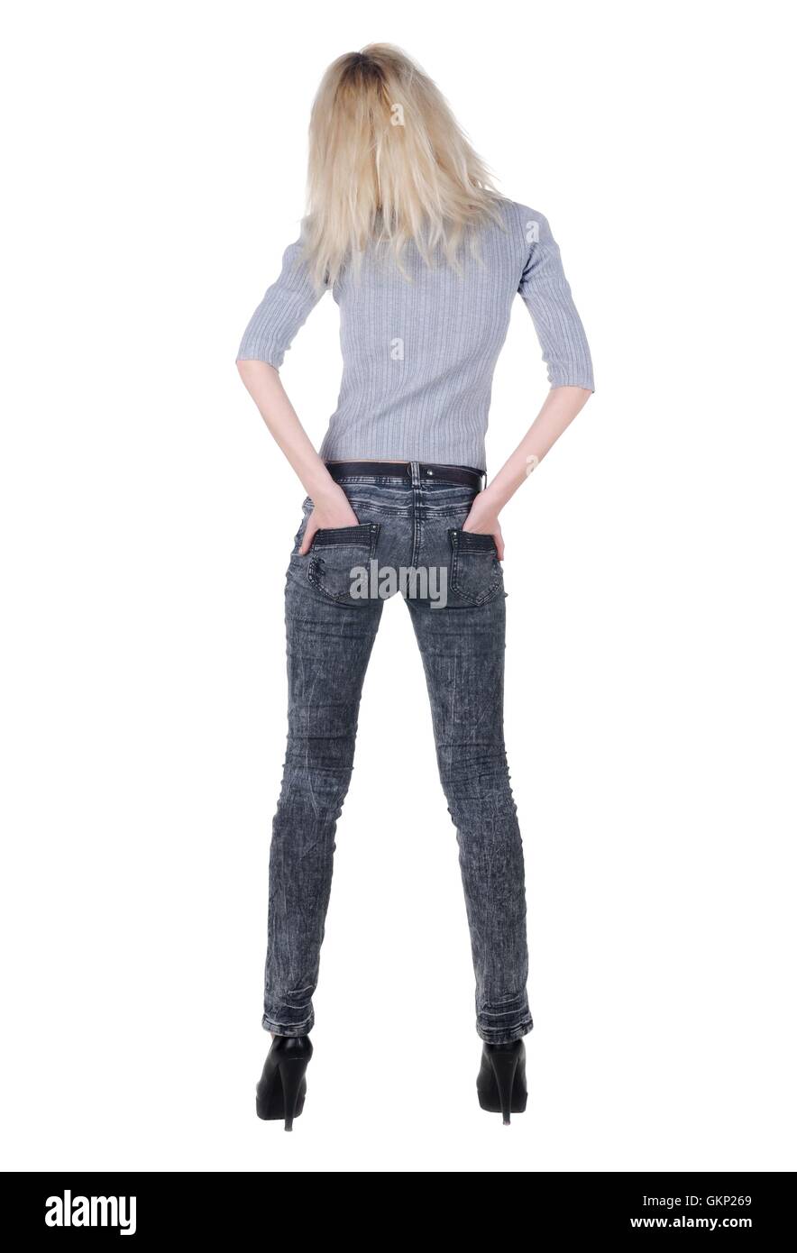 Beautiful young woman looking at wall. Rear view Stock Photo - Alamy