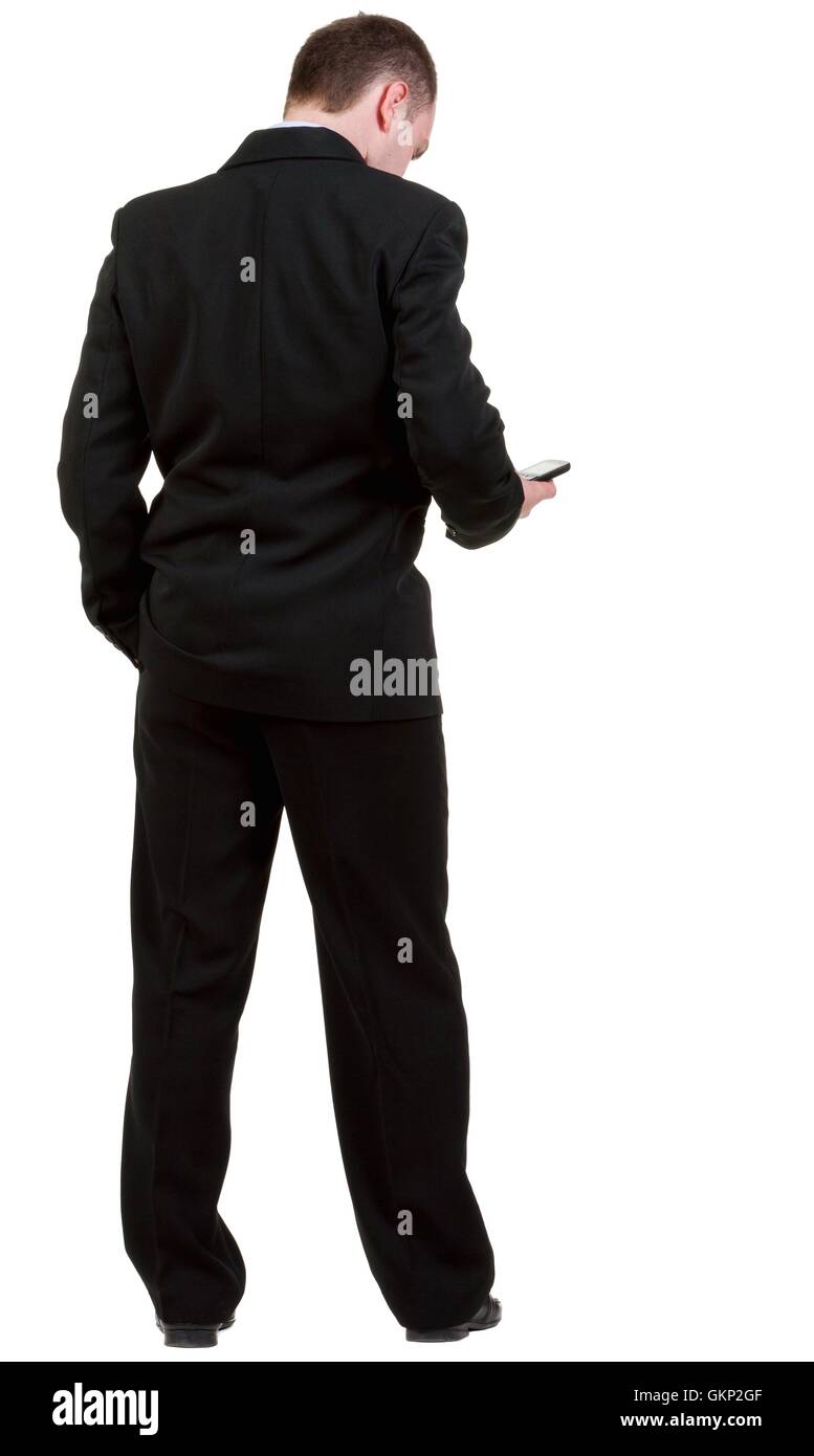 Rear view of business man in black suit talking on mobile phon Stock ...