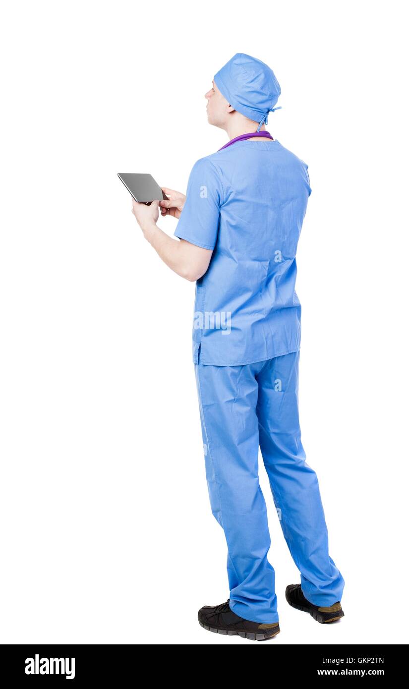 Back view of doctor in robe holding tablet computer Stock Photo